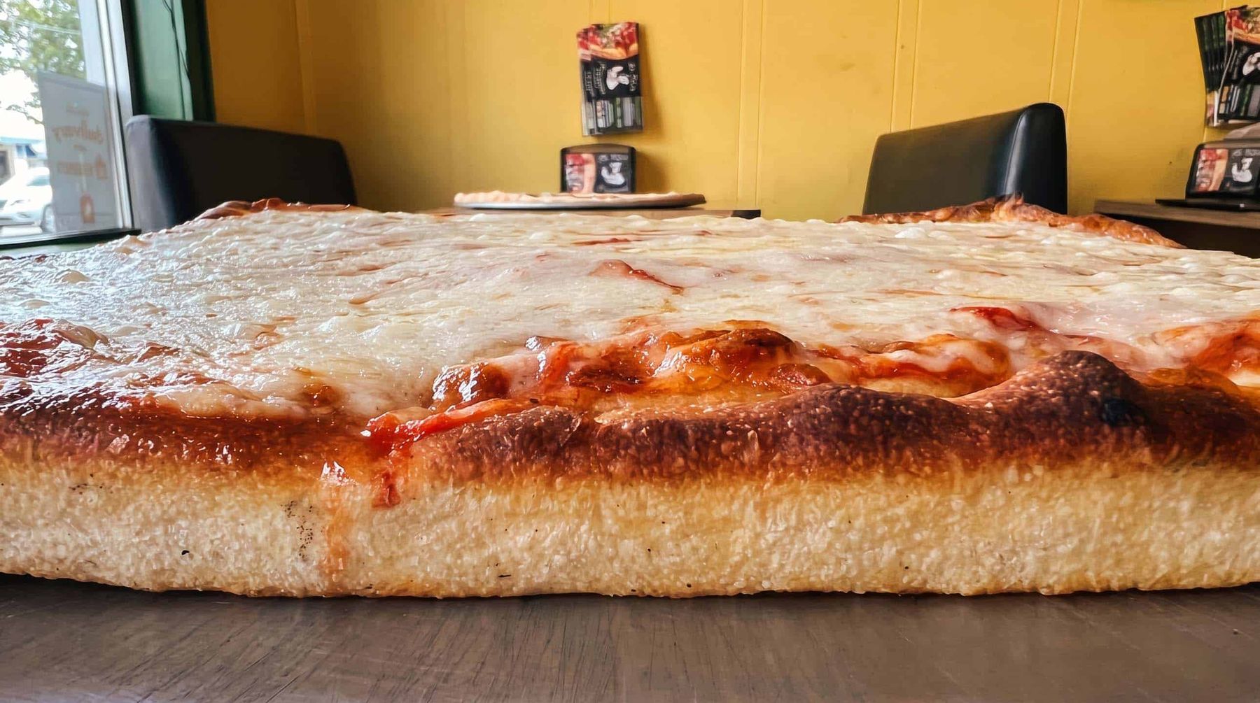 A thick square grandma-style pie fresh out of the oven at La Rosa Pizza