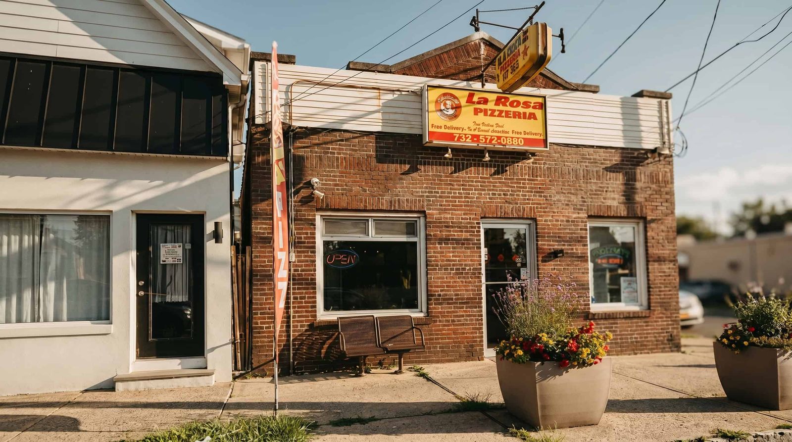 The La Rosa Pizzeria storefront on Woodbridge Avenue in Highland Park